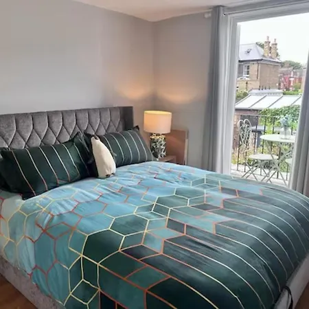 Room With Balcony Overlooking A Garden